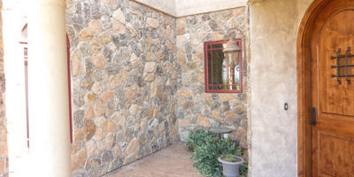 Thin stone veneer, moss rock pattern.